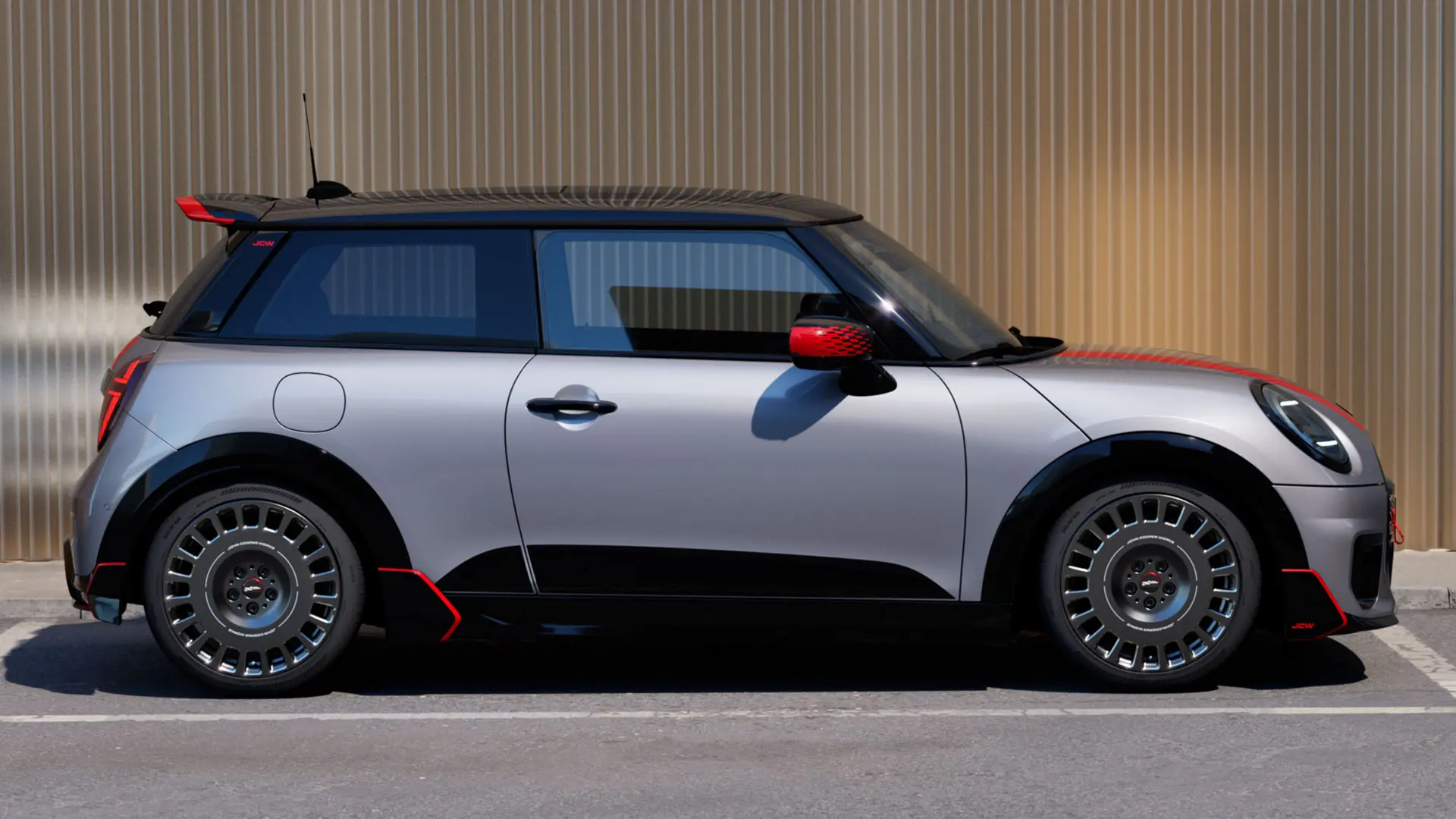 MINI Cooper 3-door in Melting Silver with John Cooper Works roof spoiler for enhanced aerodynamic properties – side view.