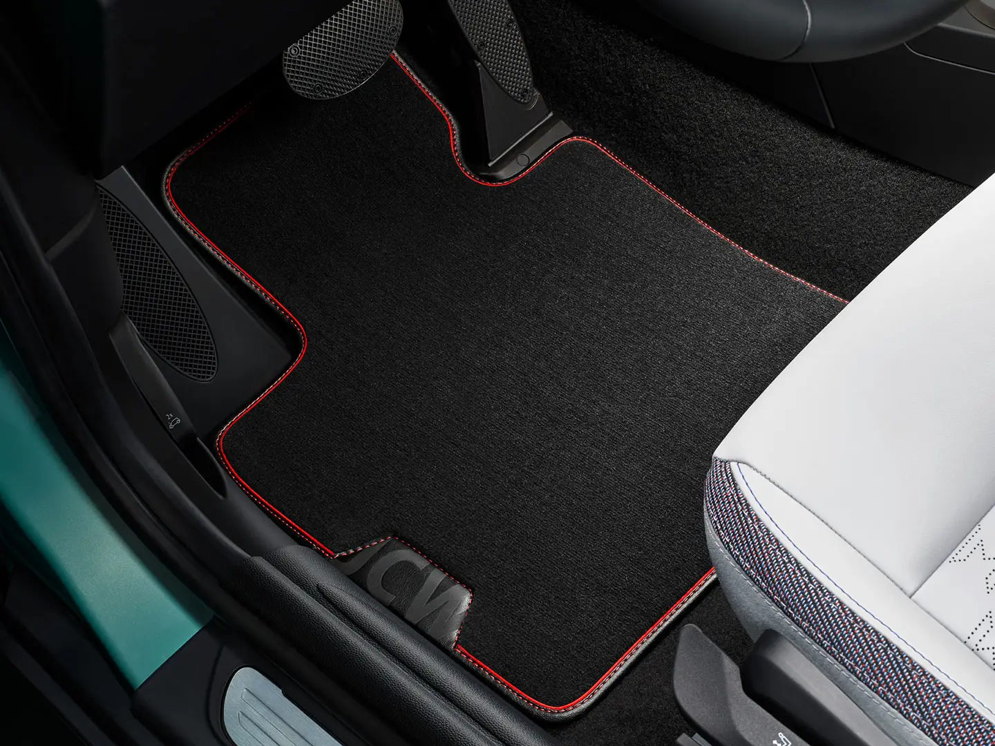 MINI John Cooper Works textile floor mat in footwell.