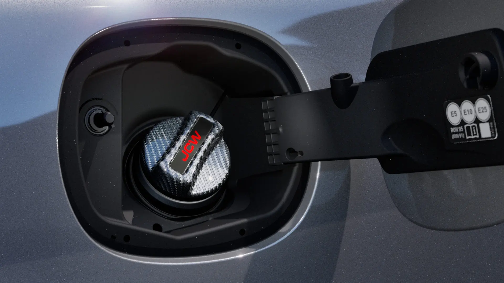 MINI John Cooper Works carbon fuel tank cap with JCW inscription.